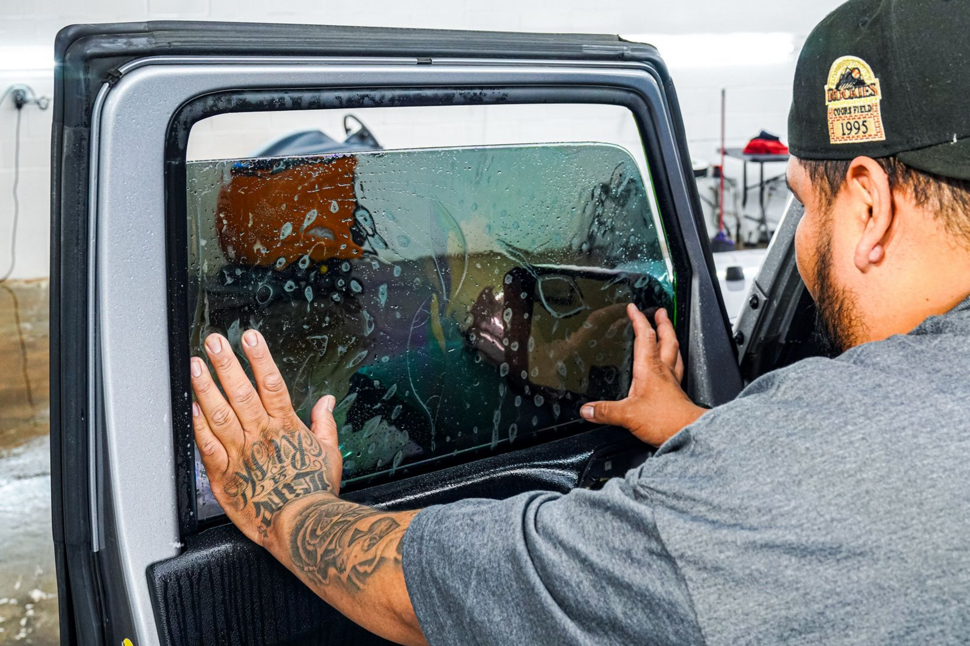 A yellow and white sports car on a black background.