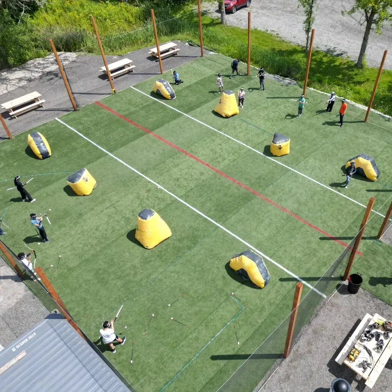 A group of people are playing a game of paintball