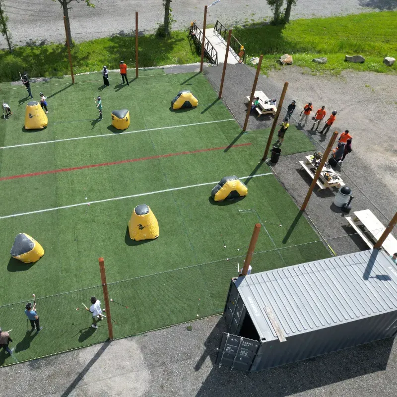 A group of people are playing a game of paintball