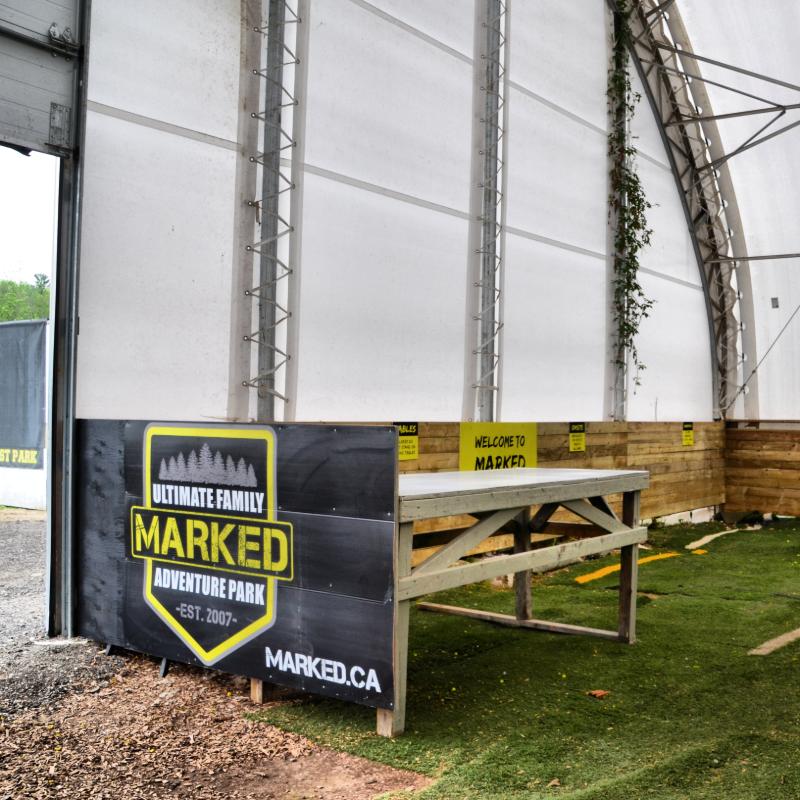 A sign for the ultimate family marked adventure park