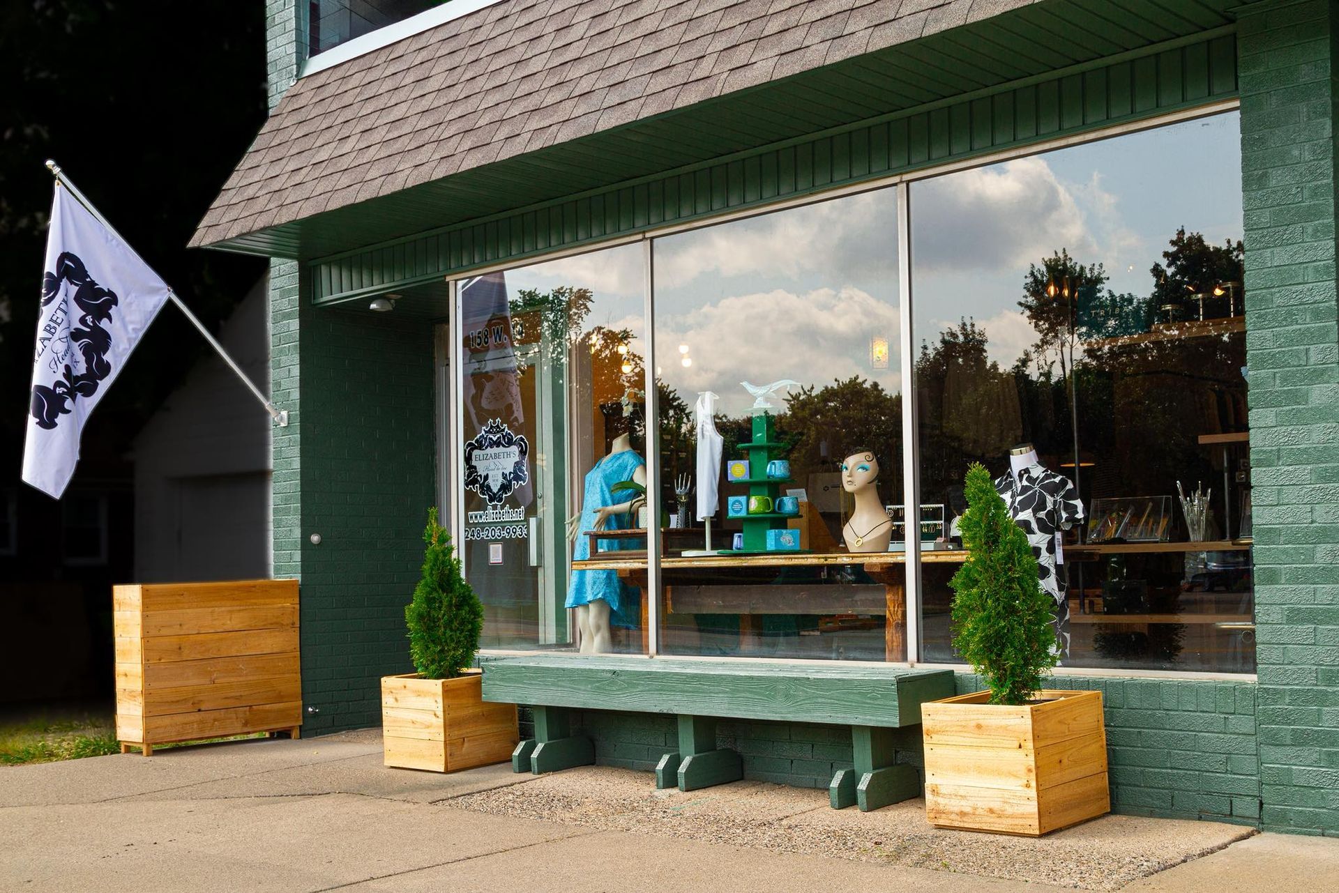 A store front with a sign that says `` eclectic home '' on it.