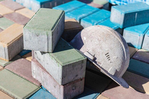 old work helmet rests folded paving slab