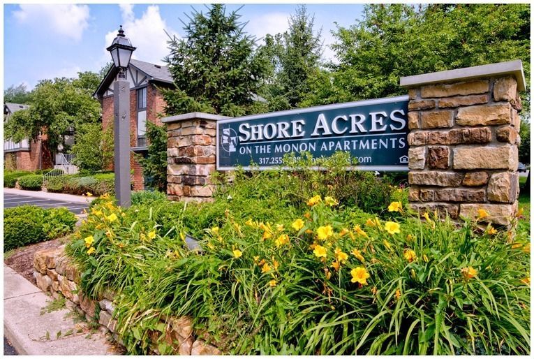 A sign that says shore acres on the front of a building