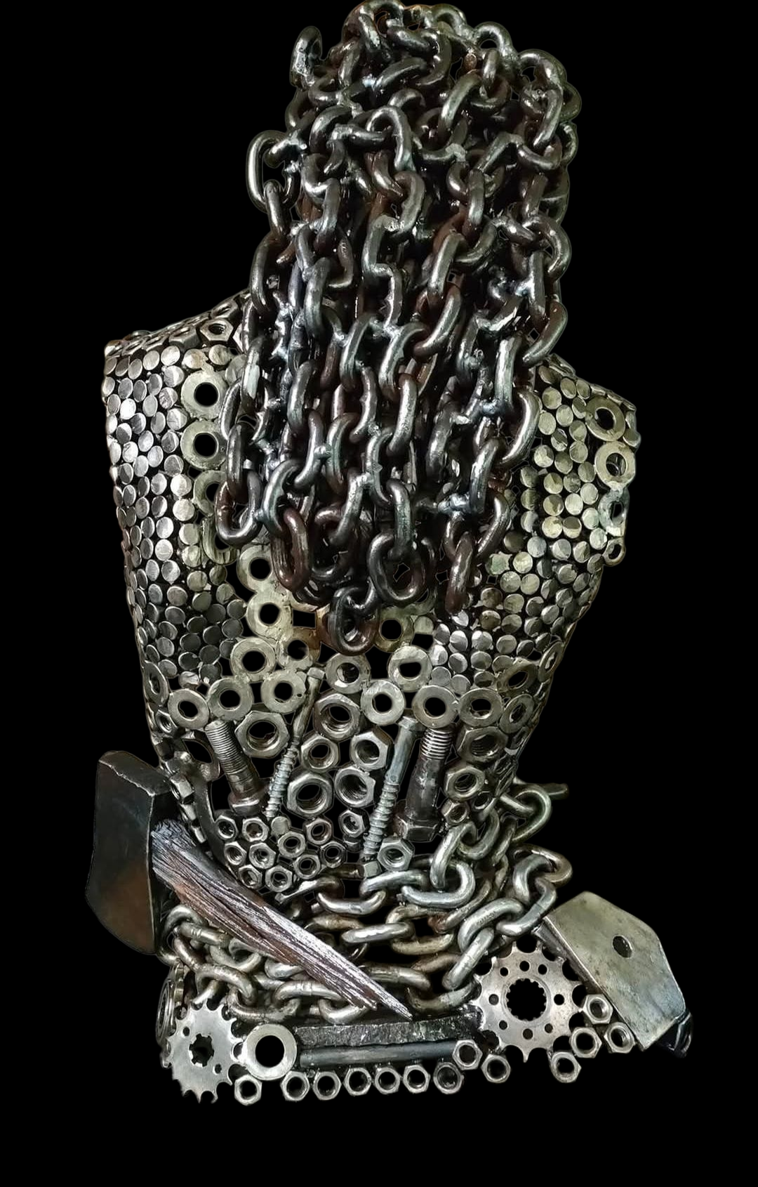 Metal sculpture of a torso made of nuts, bolts, and chains; black background.