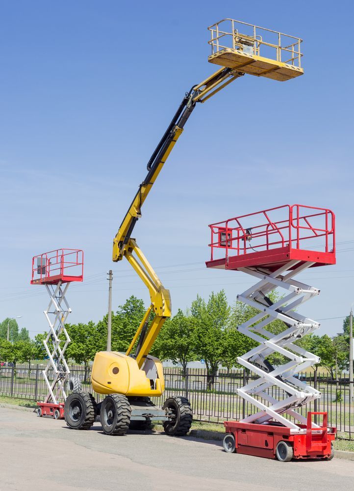 Yellow Boom Lift and Two Red Scissor Lifts — Innisfail Auto Electrics Pty Ltd in Tully, QLD