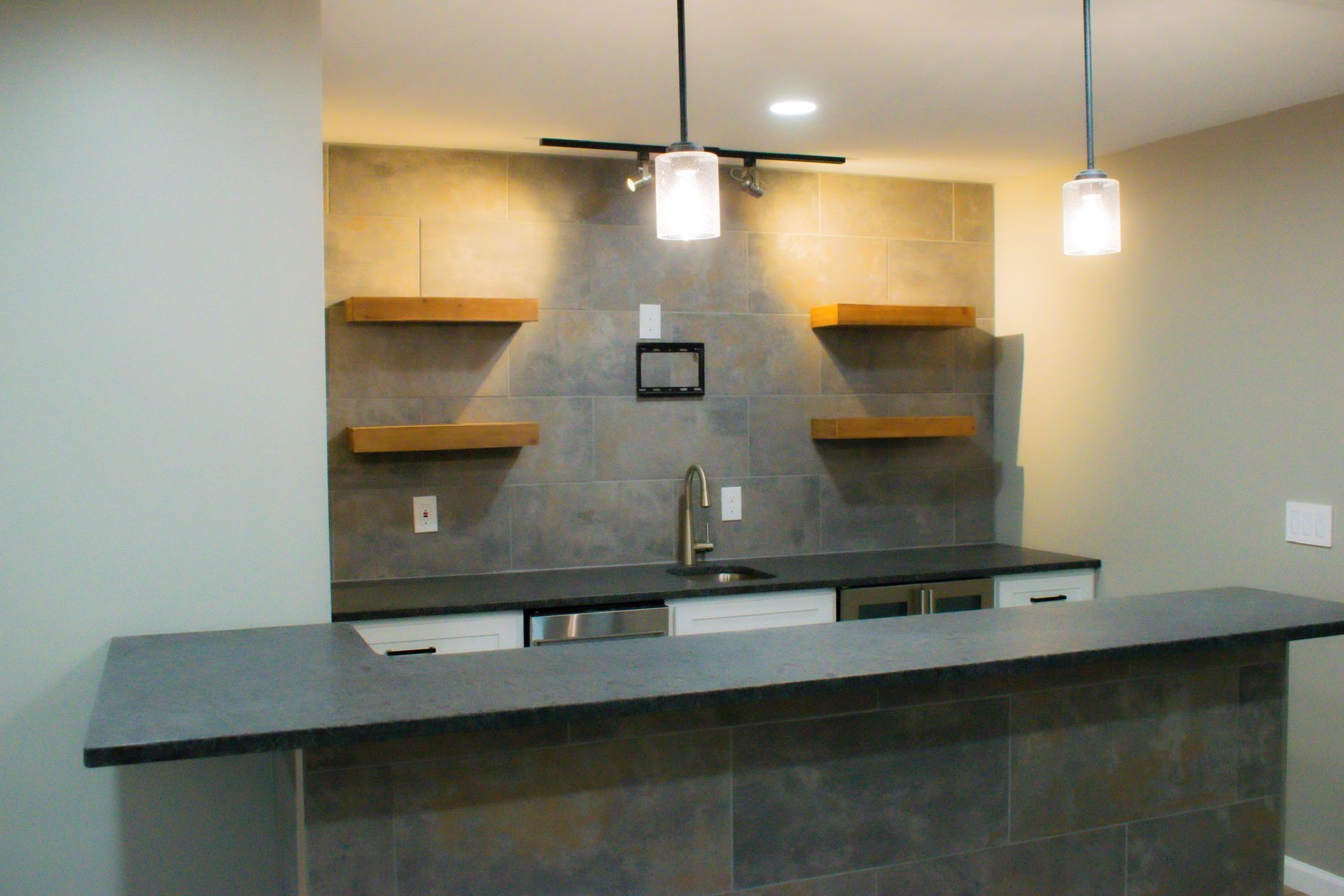 A kitchen with a large counter top and a sink