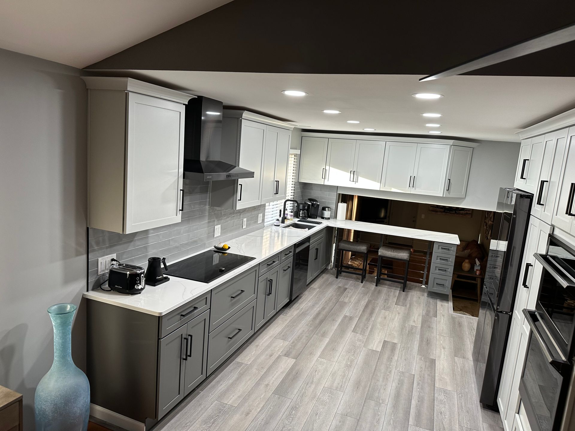 A kitchen with a lot of cabinets and appliances