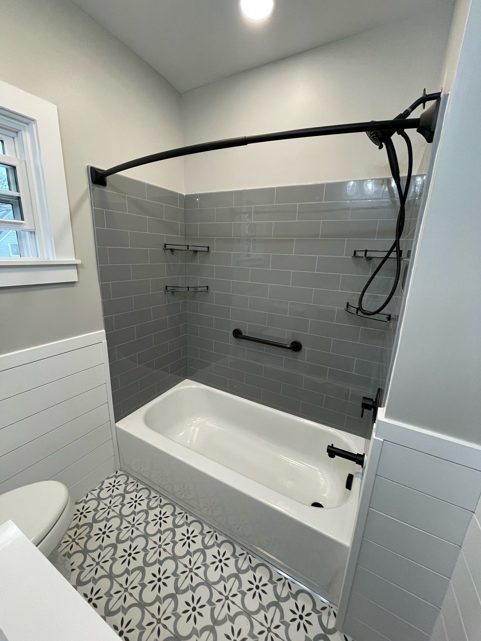 A bathroom with a bathtub and a toilet