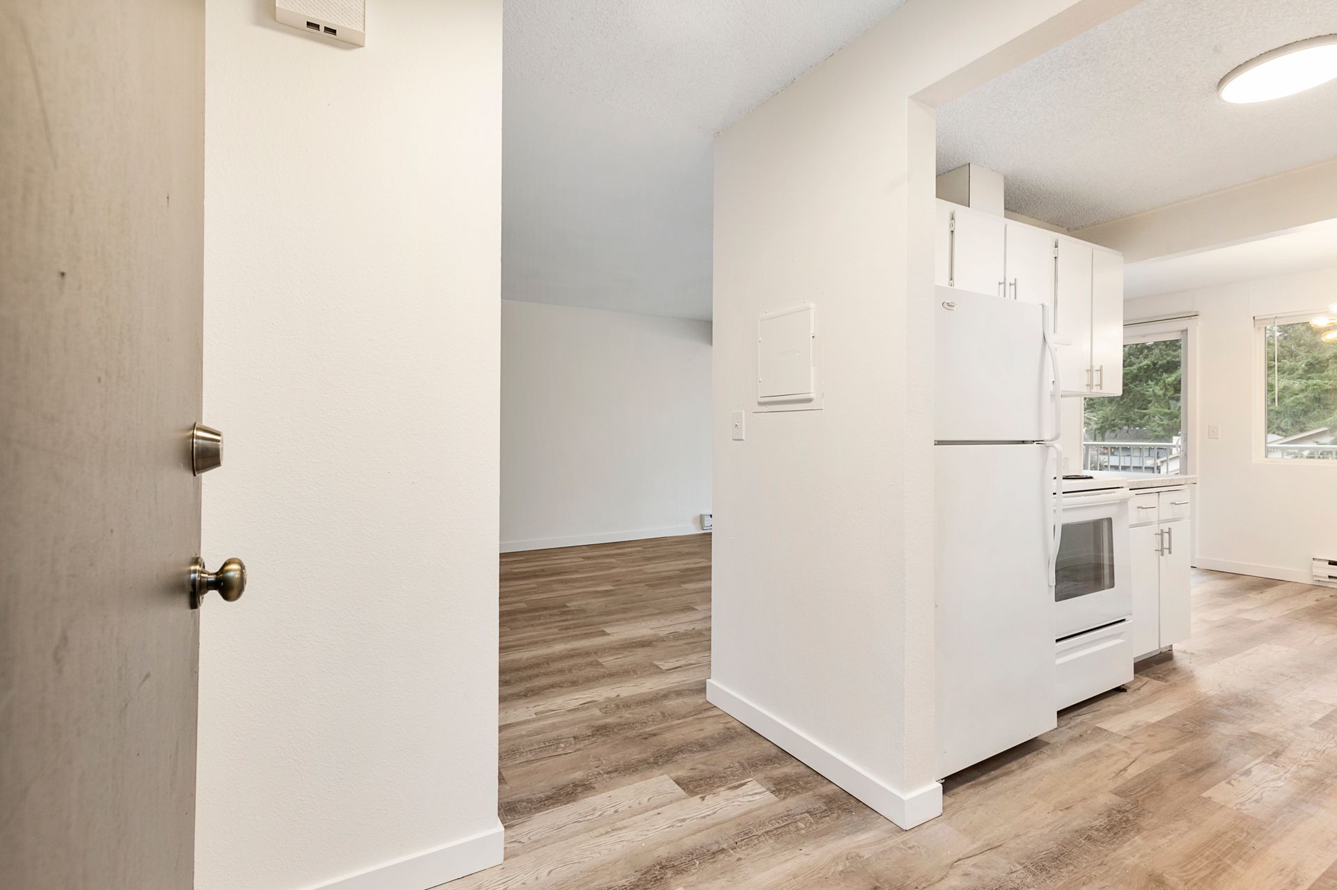 a kitchen with a refrigerator , stove , and sink .
