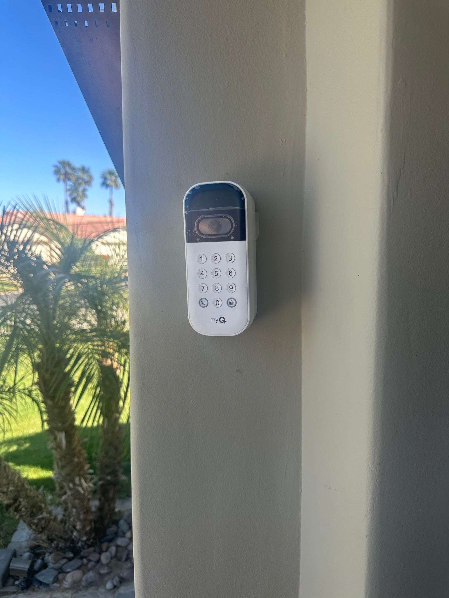 A security camera is mounted on the side of a building.