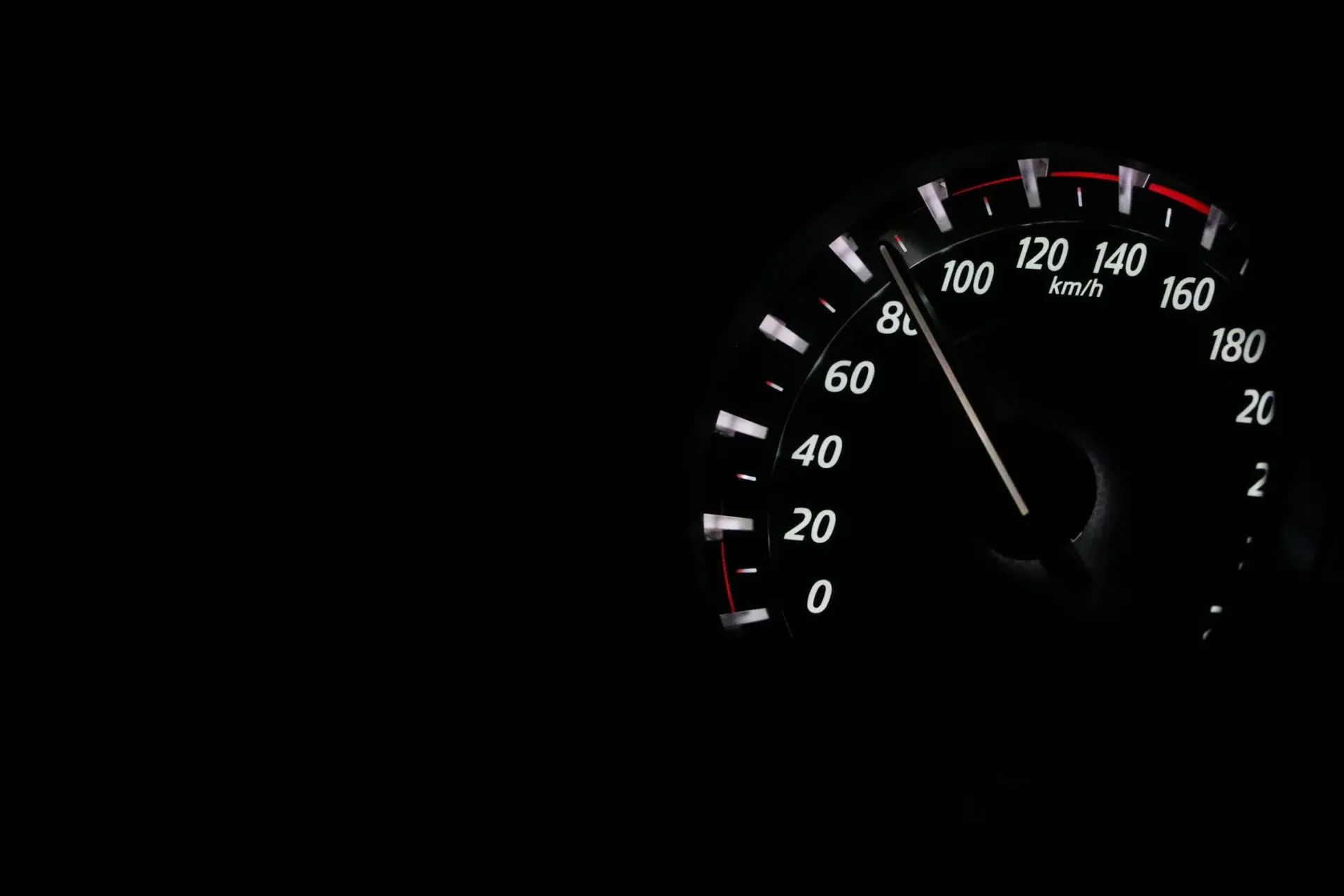 A Close Up Of A Speedometer On A Black Background — Auto Maniac in Mossman, QLD