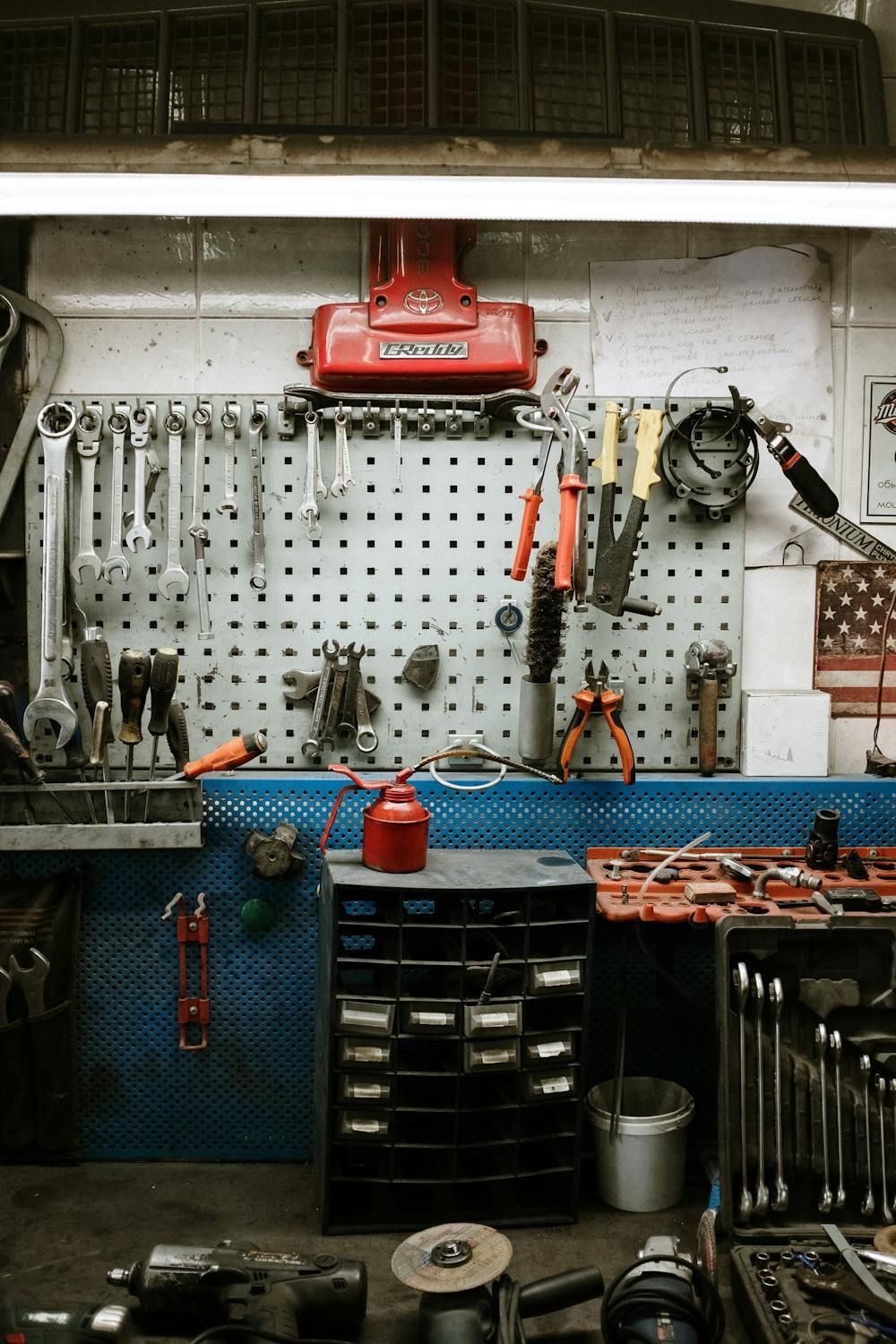 A Garage Filled With Lots Of Tools And A Vacuum Cleaner Hanging On The Wall — Auto Maniac in Mossman, QLD