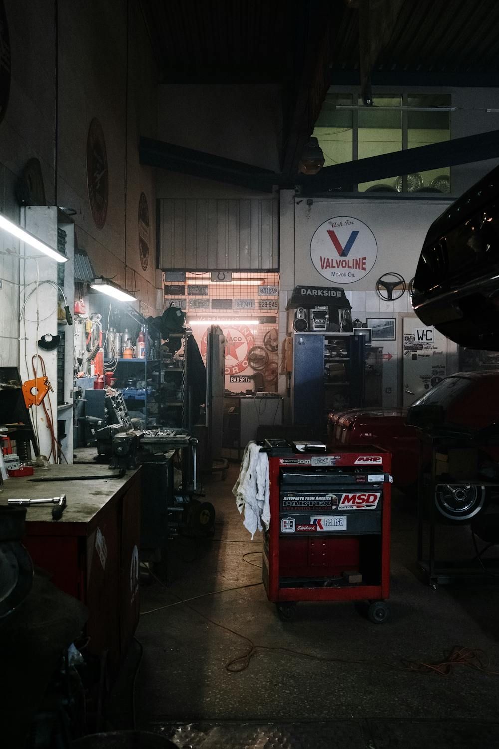 A Car Is Being Worked On In A Garage With The Hood Up — Auto Maniac in Mossman, QLD