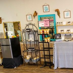 There is a table with a checkered tablecloth in the middle of the room.