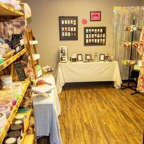 A room filled with lots of shelves and a table.