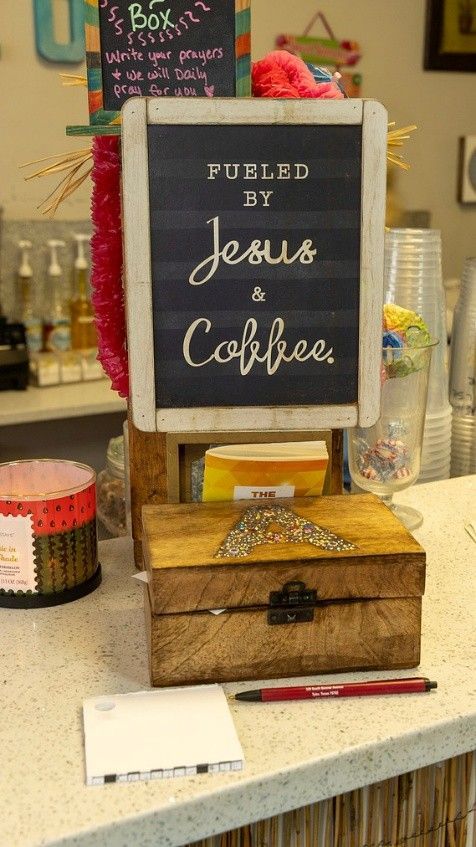 A sign on a counter that says fueled by jesus and coffee