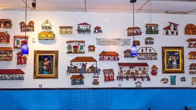 A wall with a lot of small houses on it