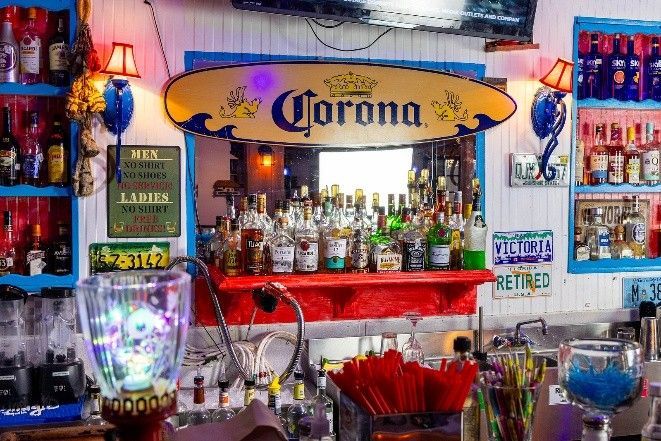 A bar with a sign that says corona on it