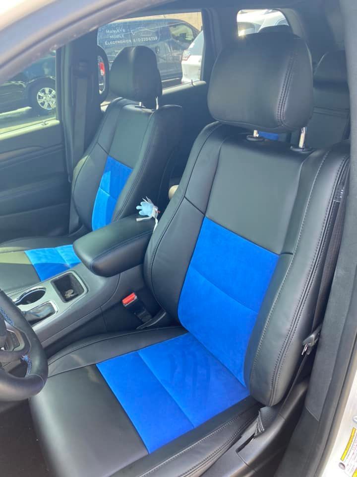 The front seats of a car are black and blue.