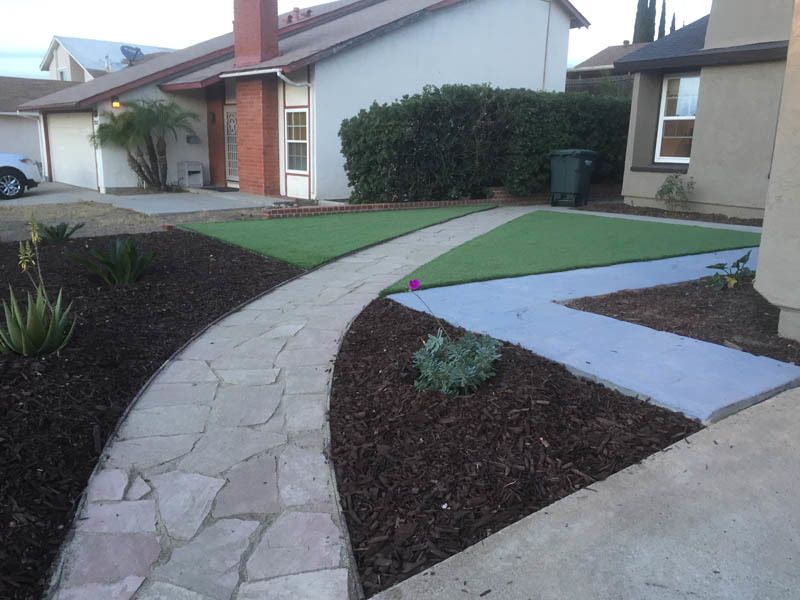 A house with a walkway leading to it