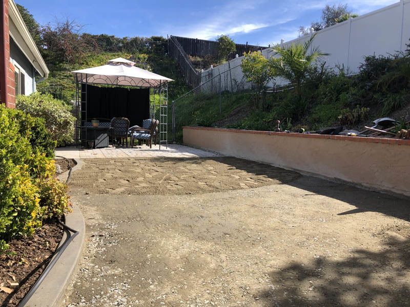 There is a gazebo in the backyard of a house