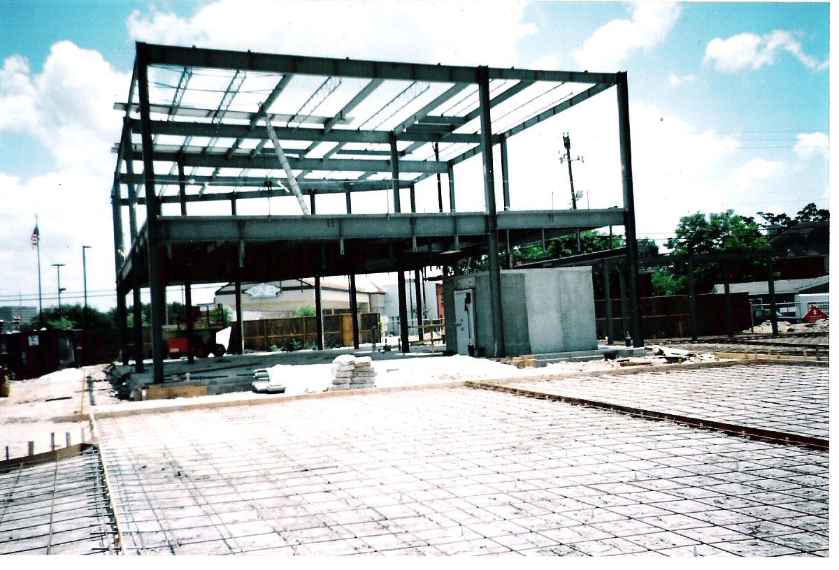 A picture of a building under construction with a blue sky in the background