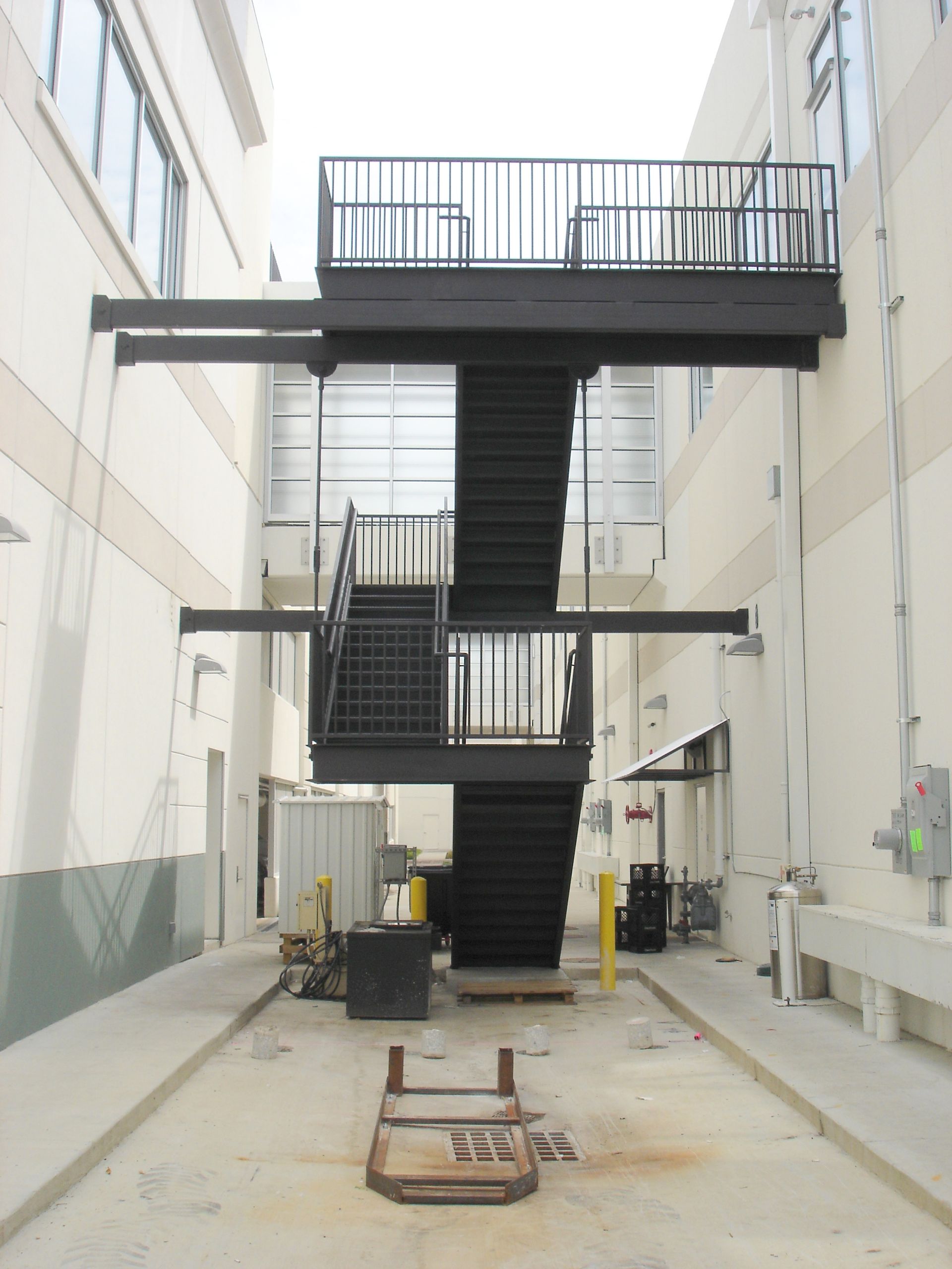 A building with a staircase leading up to a balcony