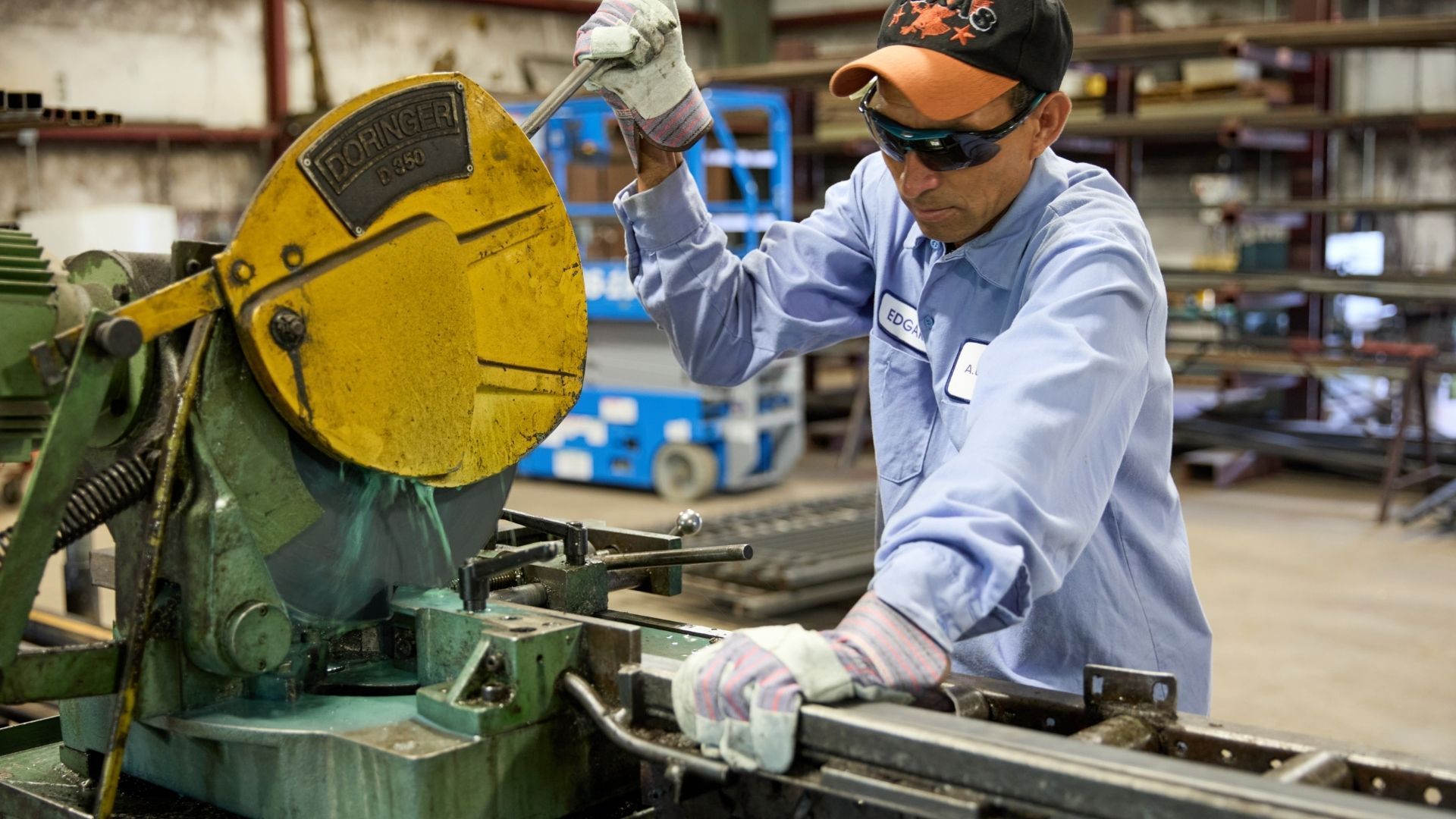 A man is working on a machine in a factory.