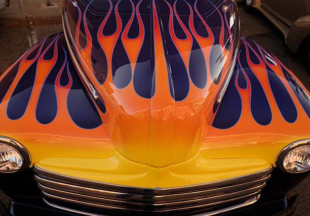 A close up of a car with flames painted on it