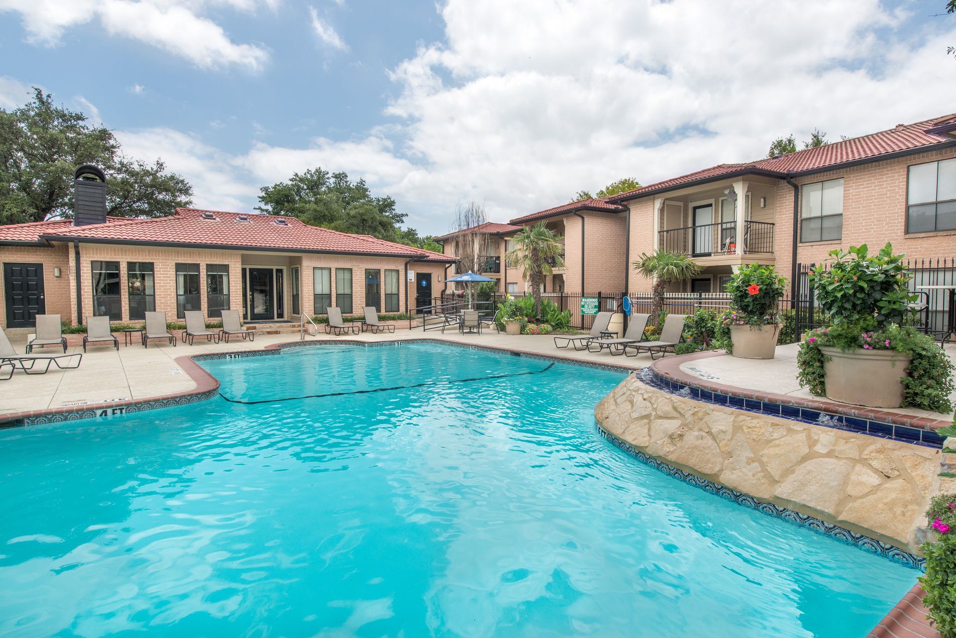 A picture of a mountain with a sun in the middle on a white background.