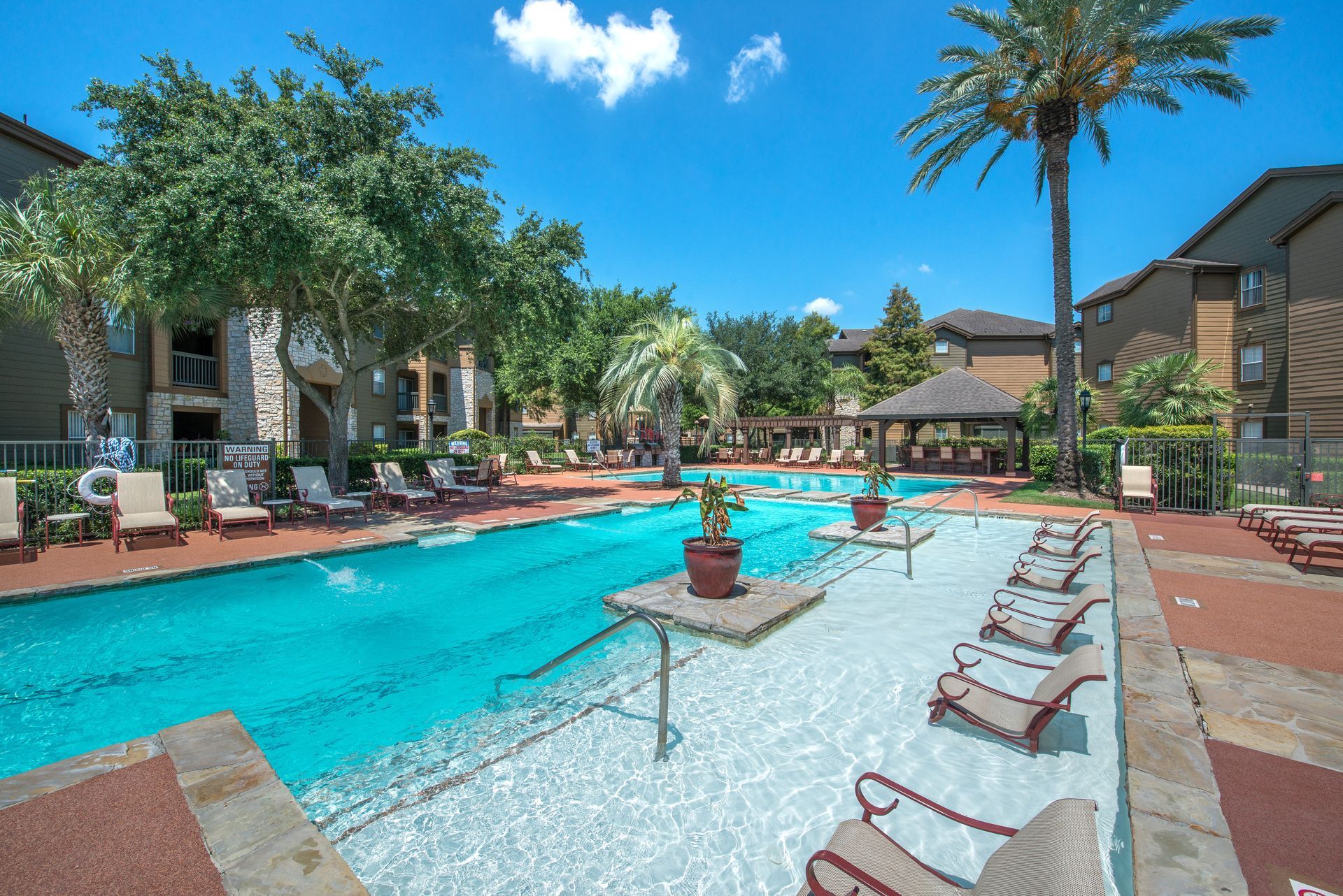 A group of people are sitting on a couch eating food.