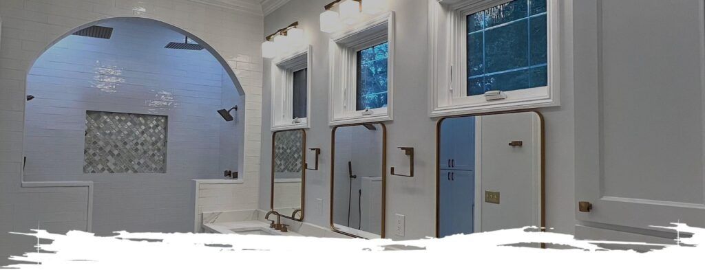 Interior with white walls, windows, and arched openings, with a blue sky visible.