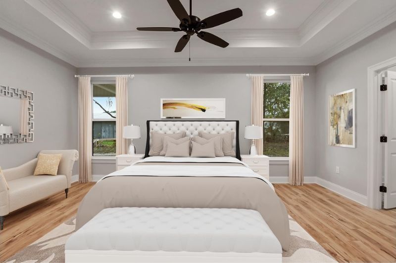 Elegant bedroom with a tufted headboard, white bedding, and neutral color scheme.