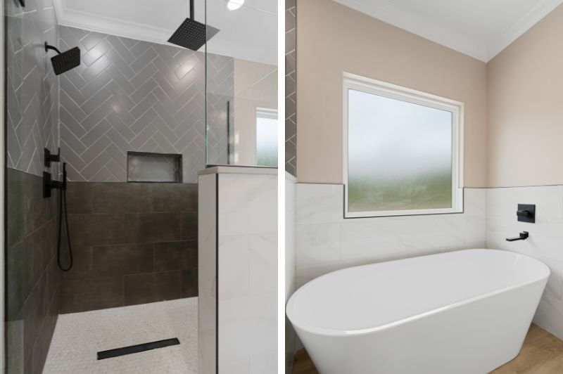 Bathroom with tiled shower, black fixtures, and a freestanding tub.