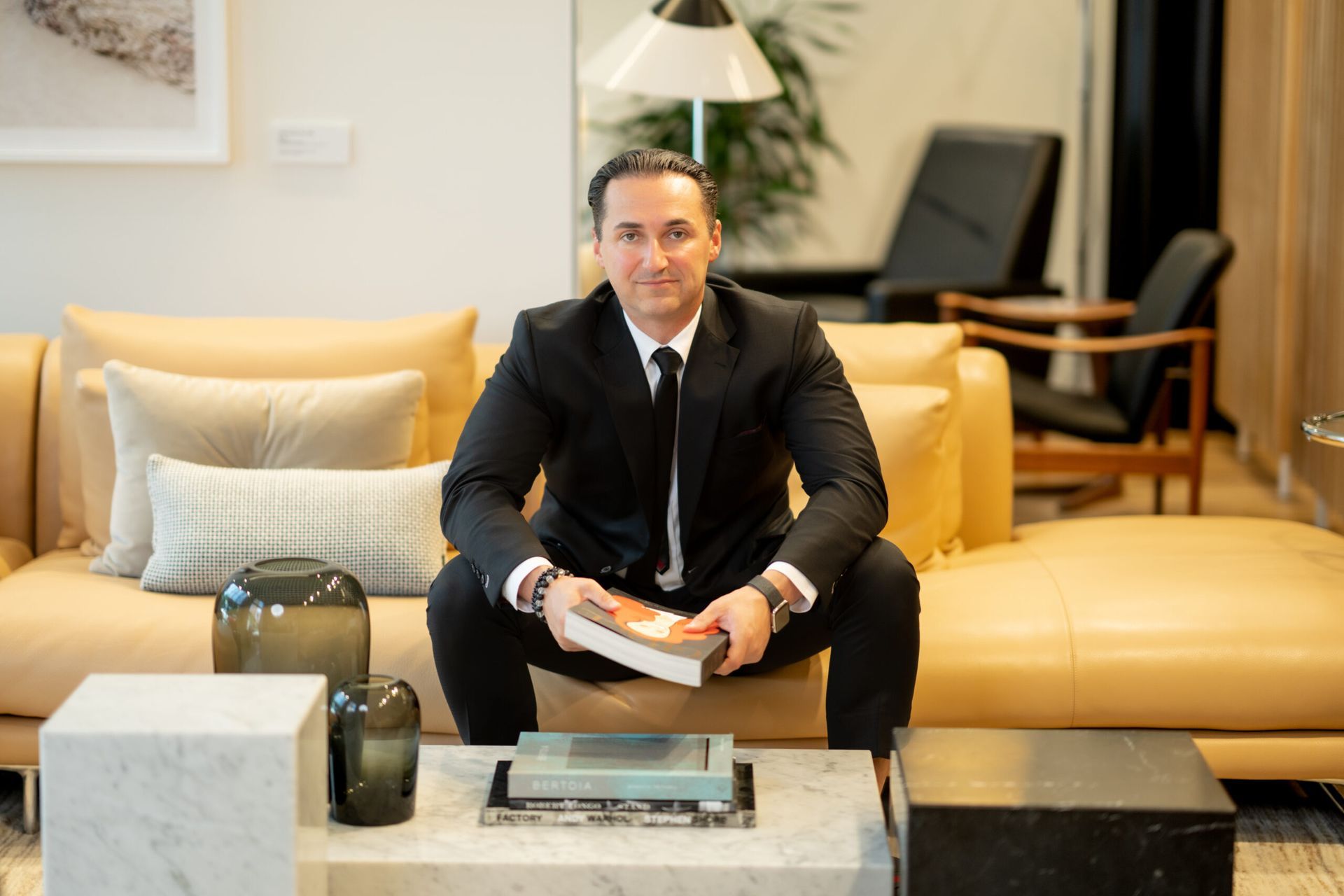 Mitch Boraski in a blue suit and white shirt is smiling for the camera.