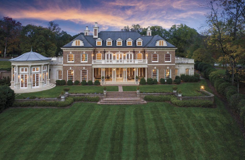 Luxury estate in Charlotte NC with brick facade and circular driveway