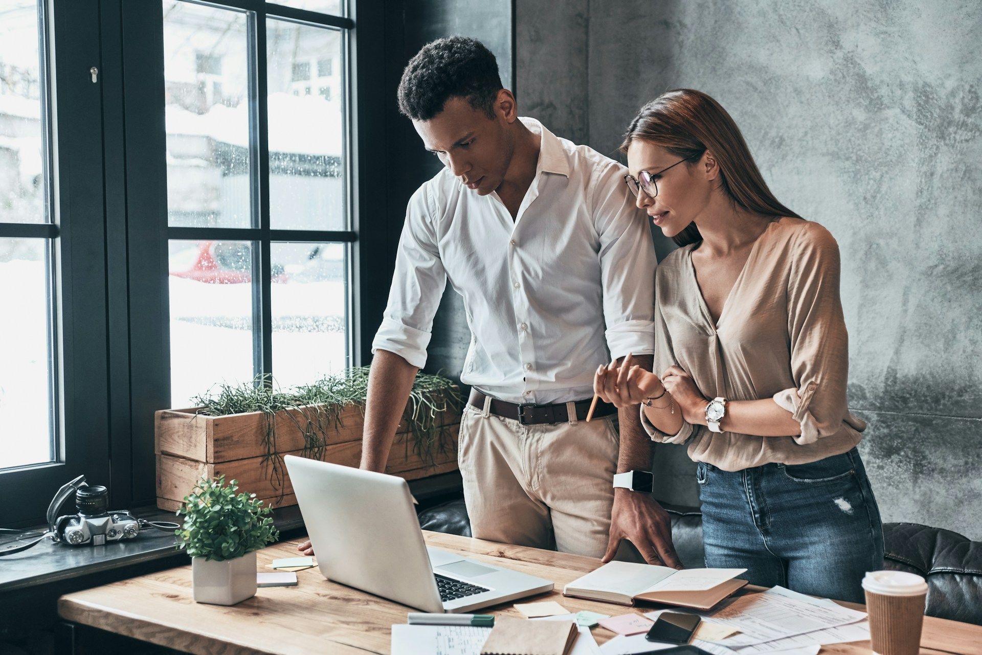 two business people looking at a laptop