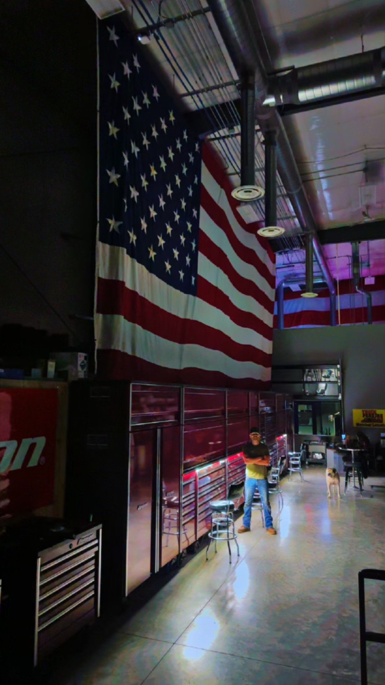 White semi-truck with open hood, exposing engine.