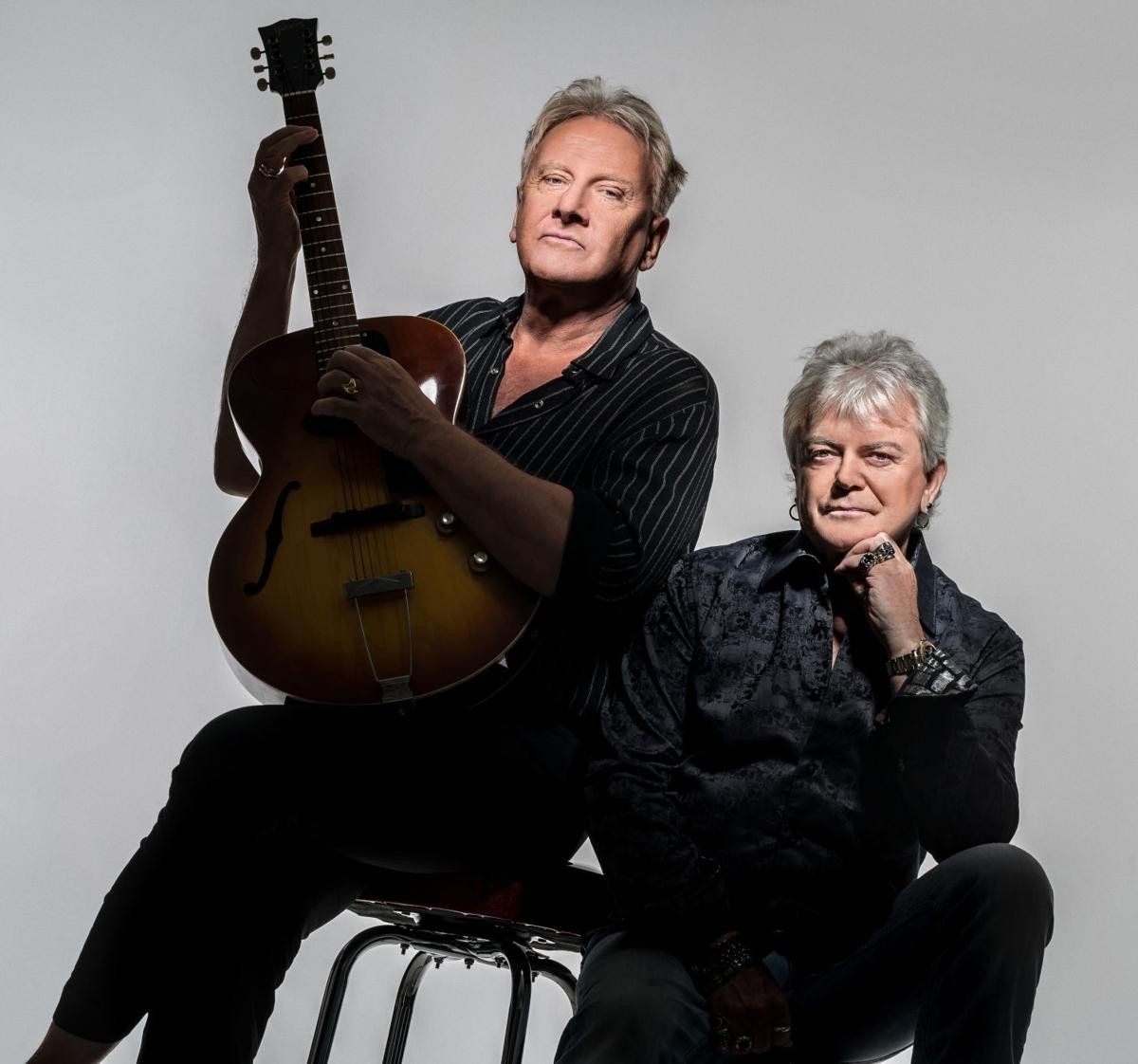Air Supply members with a guitar for Denture Doctor