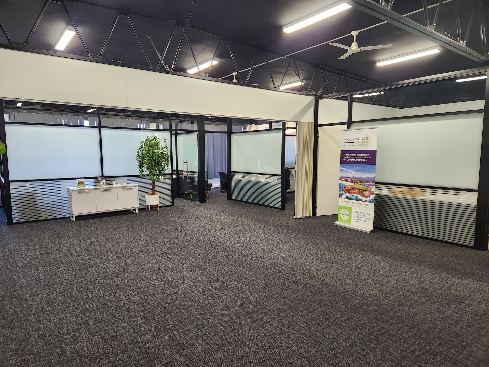 Shop Front Windows with Custom Wrap — Professional Signwriter in the Illawarra