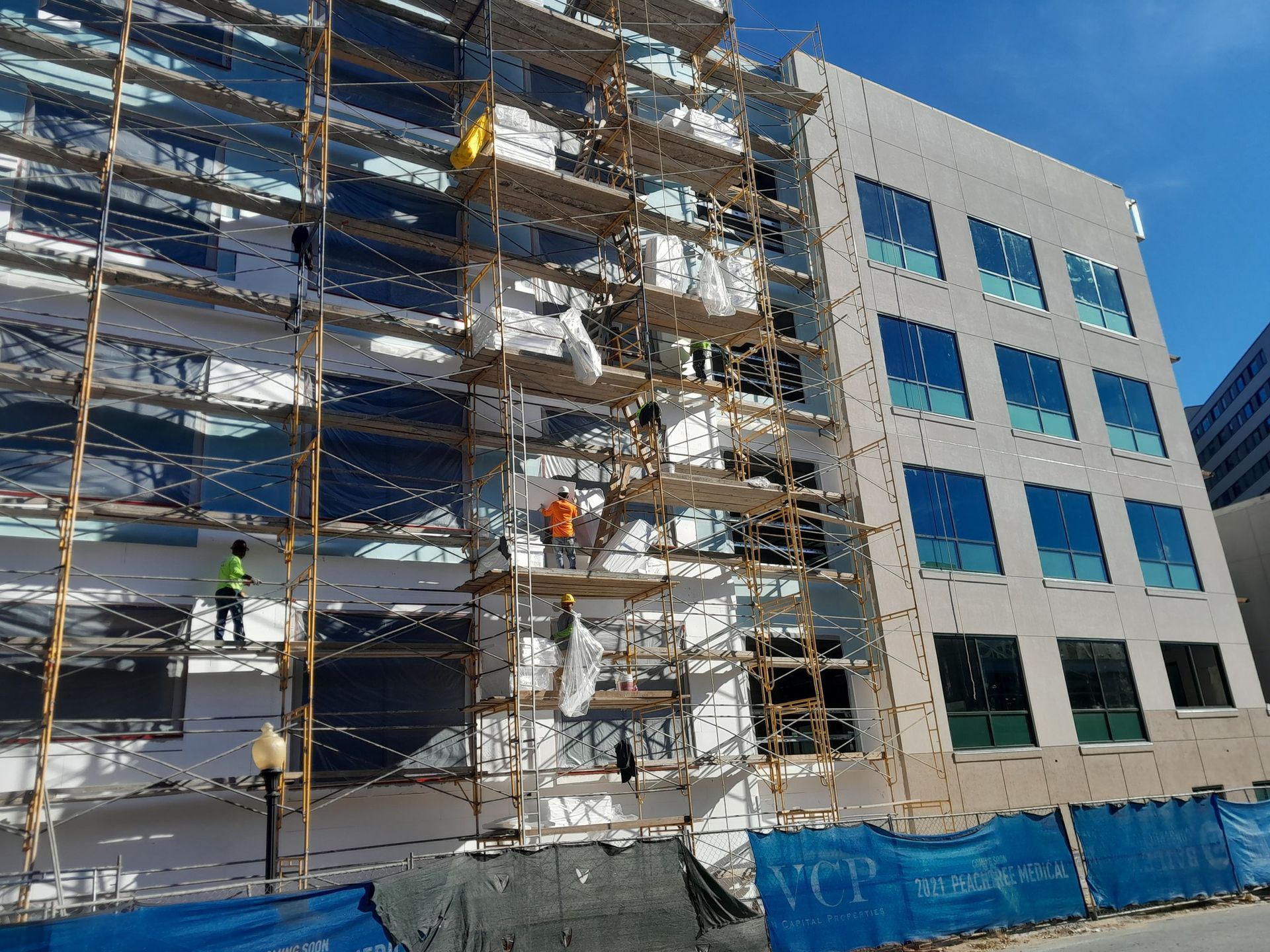A building is being built with scaffolding around it.