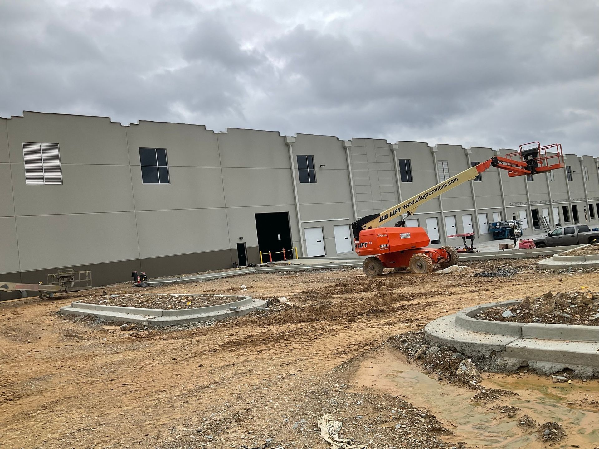 A large building is being built with a crane in front of it.