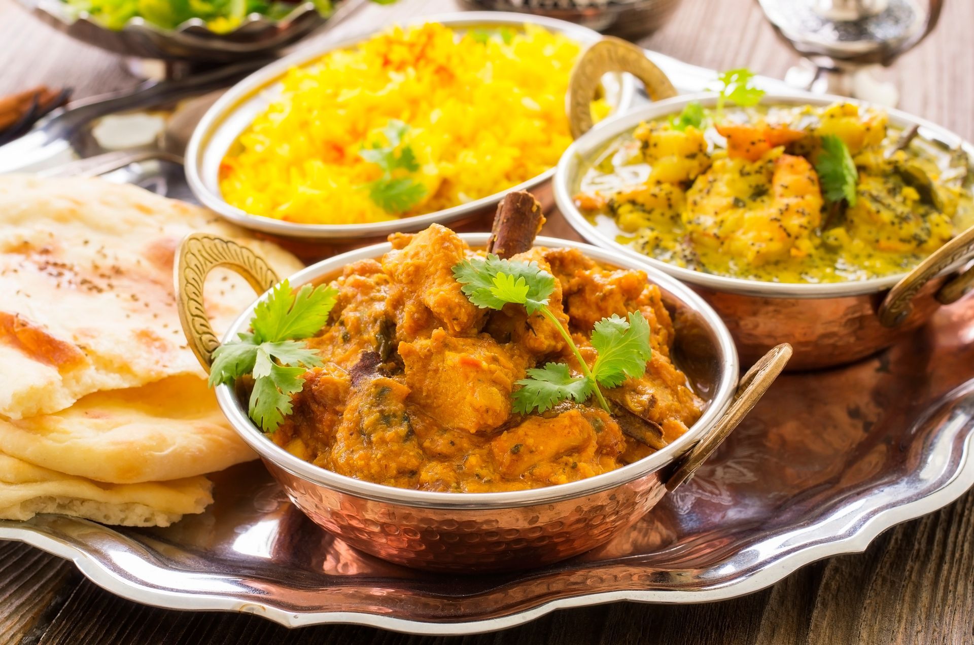 Indian Curries And Masalas With Flatbread And Rice