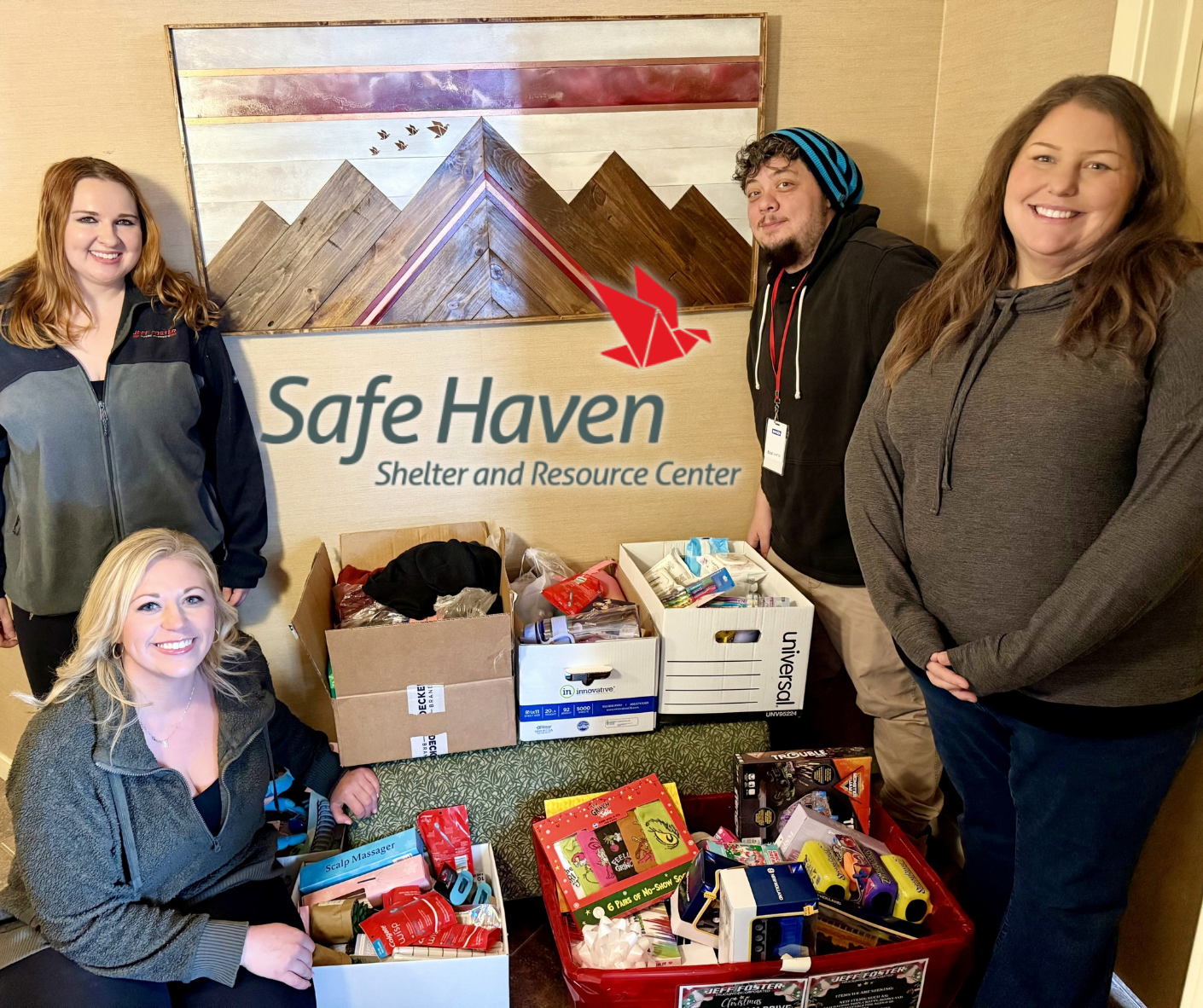 People with donations stand in front of