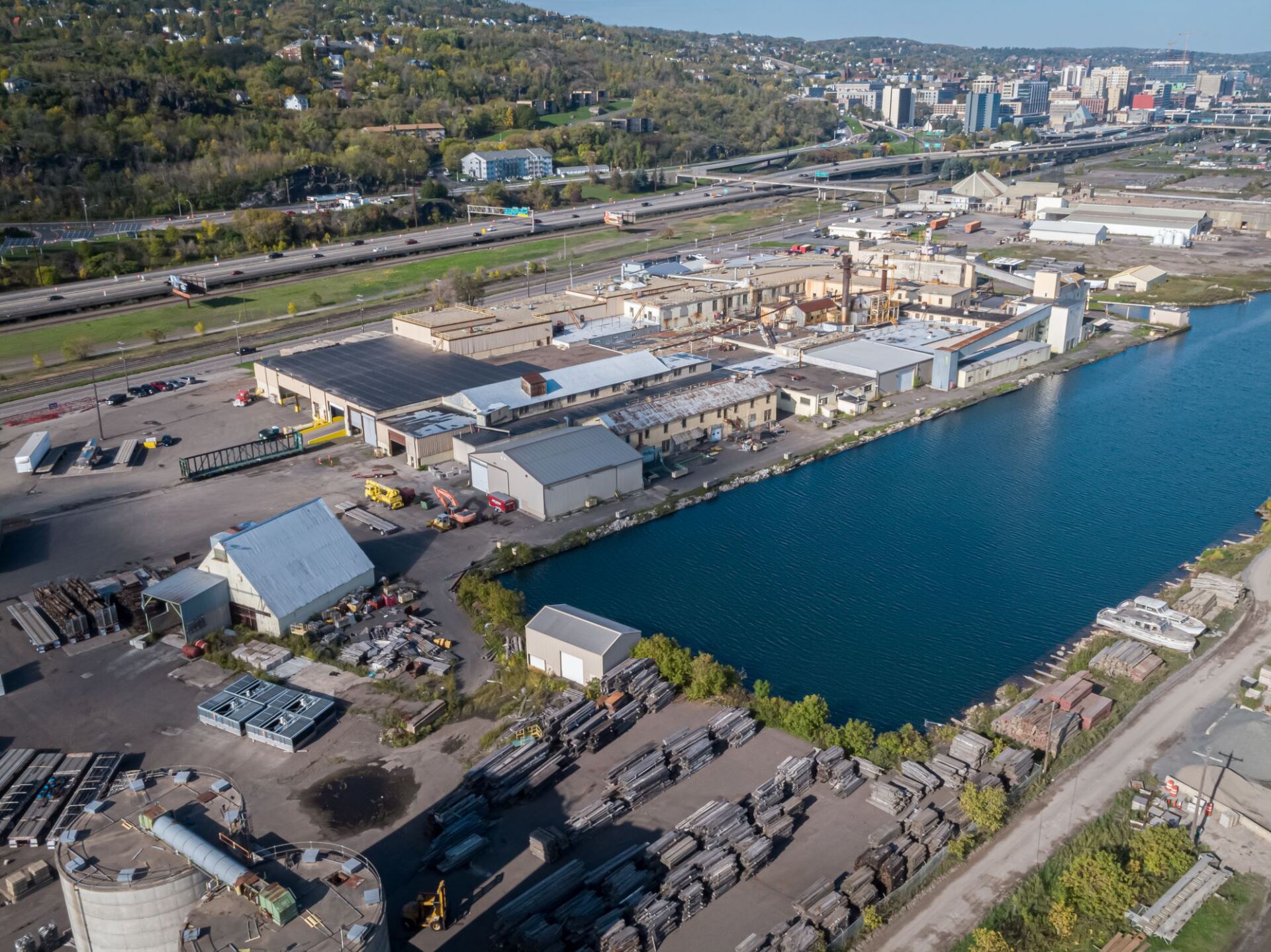An aerial view of a large body of water surrounded by buildings.