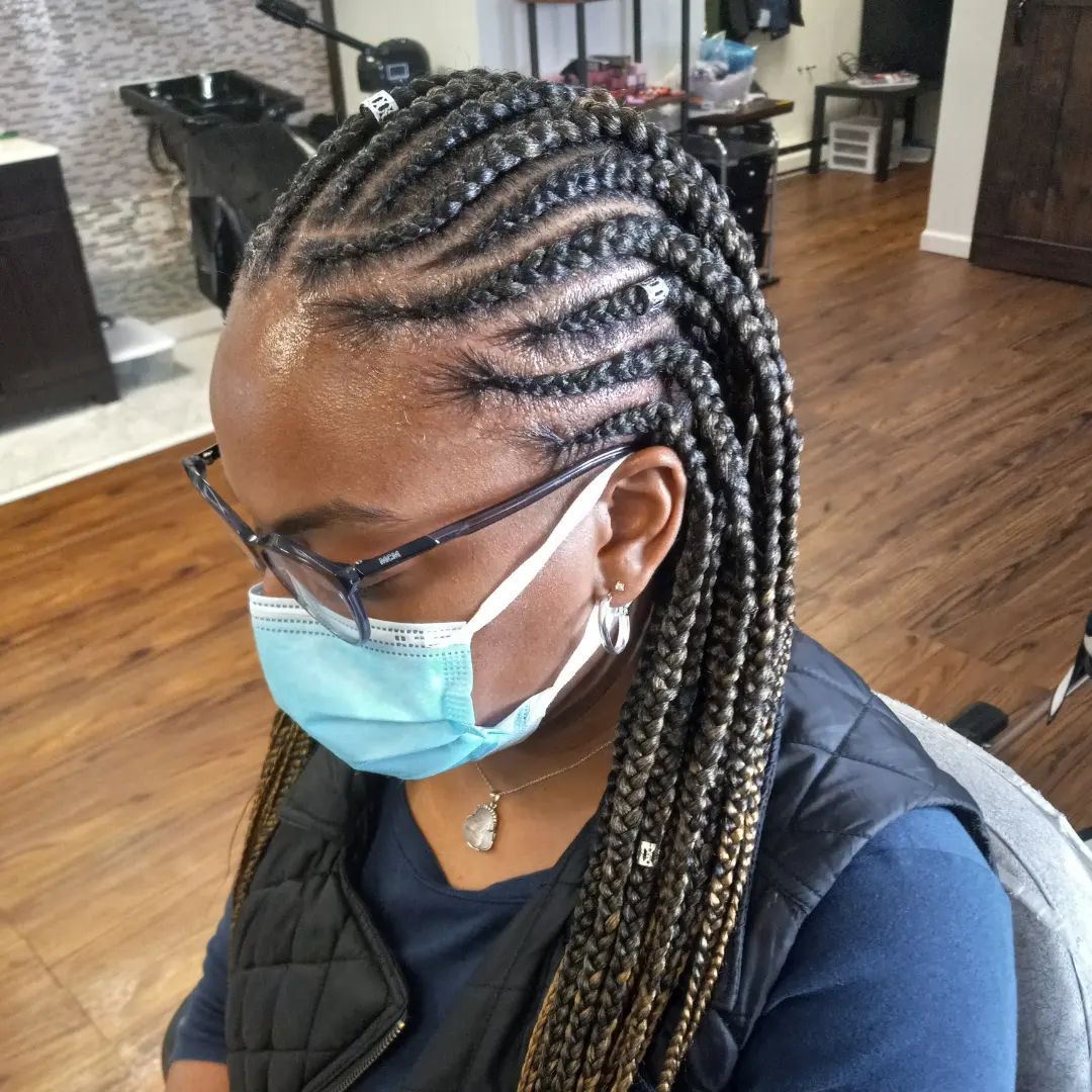 Photo of a woman with protective styles