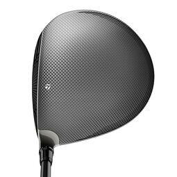 A TaylorMade R15 golf driver club with a dark gray carbon fiber crown and black shaft.