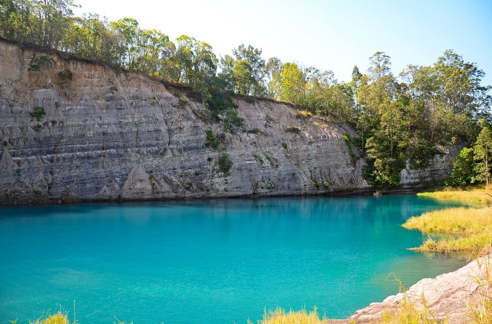 There is a Large Body of Water in the Middle of a Canyon Surrounded by Trees — Ocean Air Electrical in Lismore, NSW