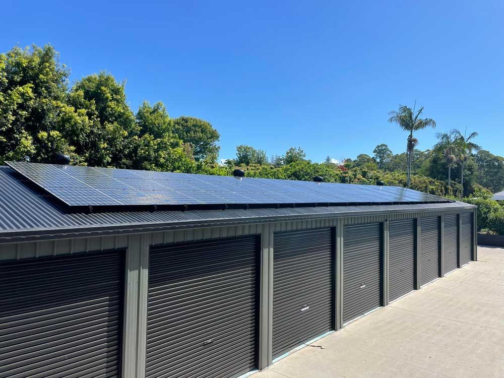 A Row of Garage Doors With Solar Panels on the Roof — Ocean Air Electrical in Bangalow, NSW