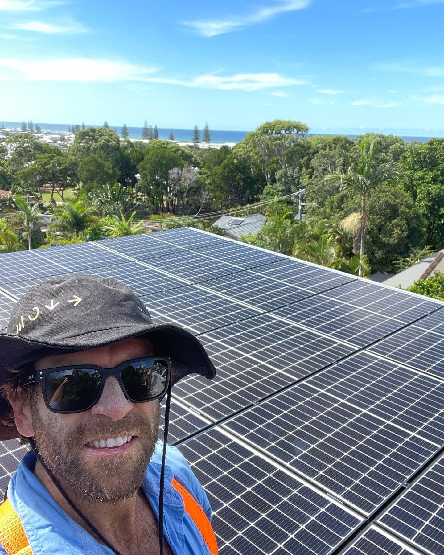 A Roof With a Lot of Solar Panels on It and a Field in the Background — Ocean Air Electrical in Skennars Head, NSW